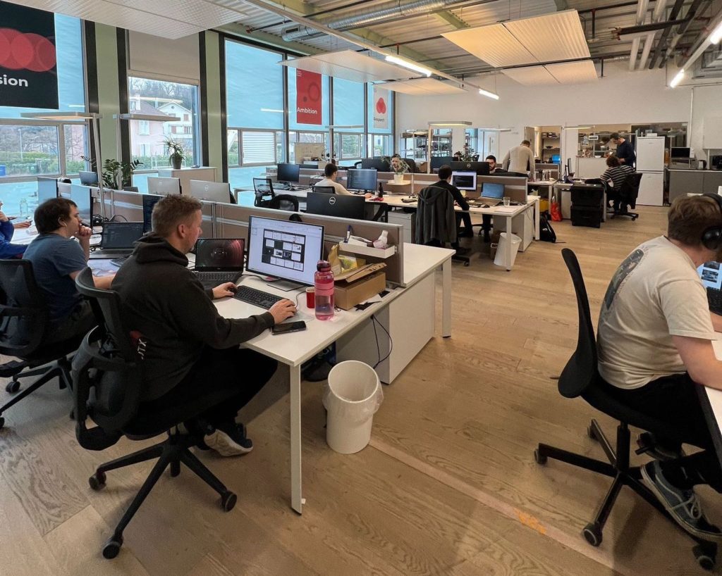 Flybotix office of employees working on computers